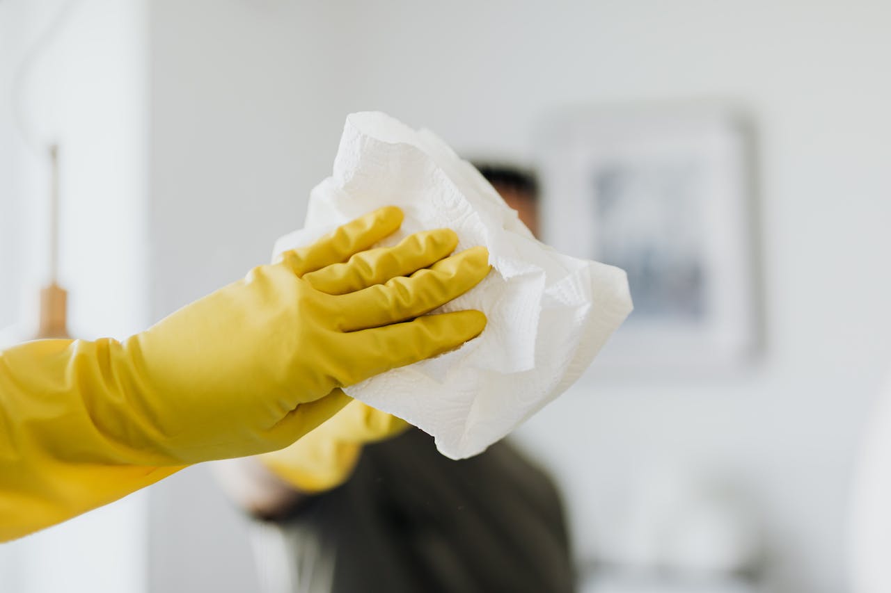 pexels-karola-g-4239127 cleaning a mirror