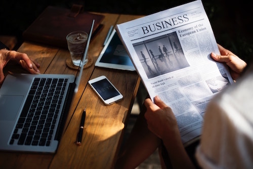 person reading a business paper in their North Carolina property