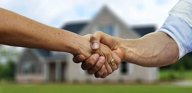 handshake in front of home